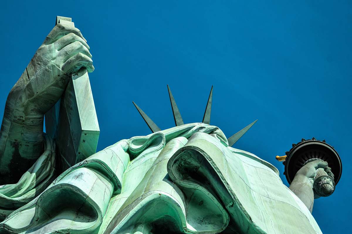 united states low angle photography of Statue of Liberty blue
